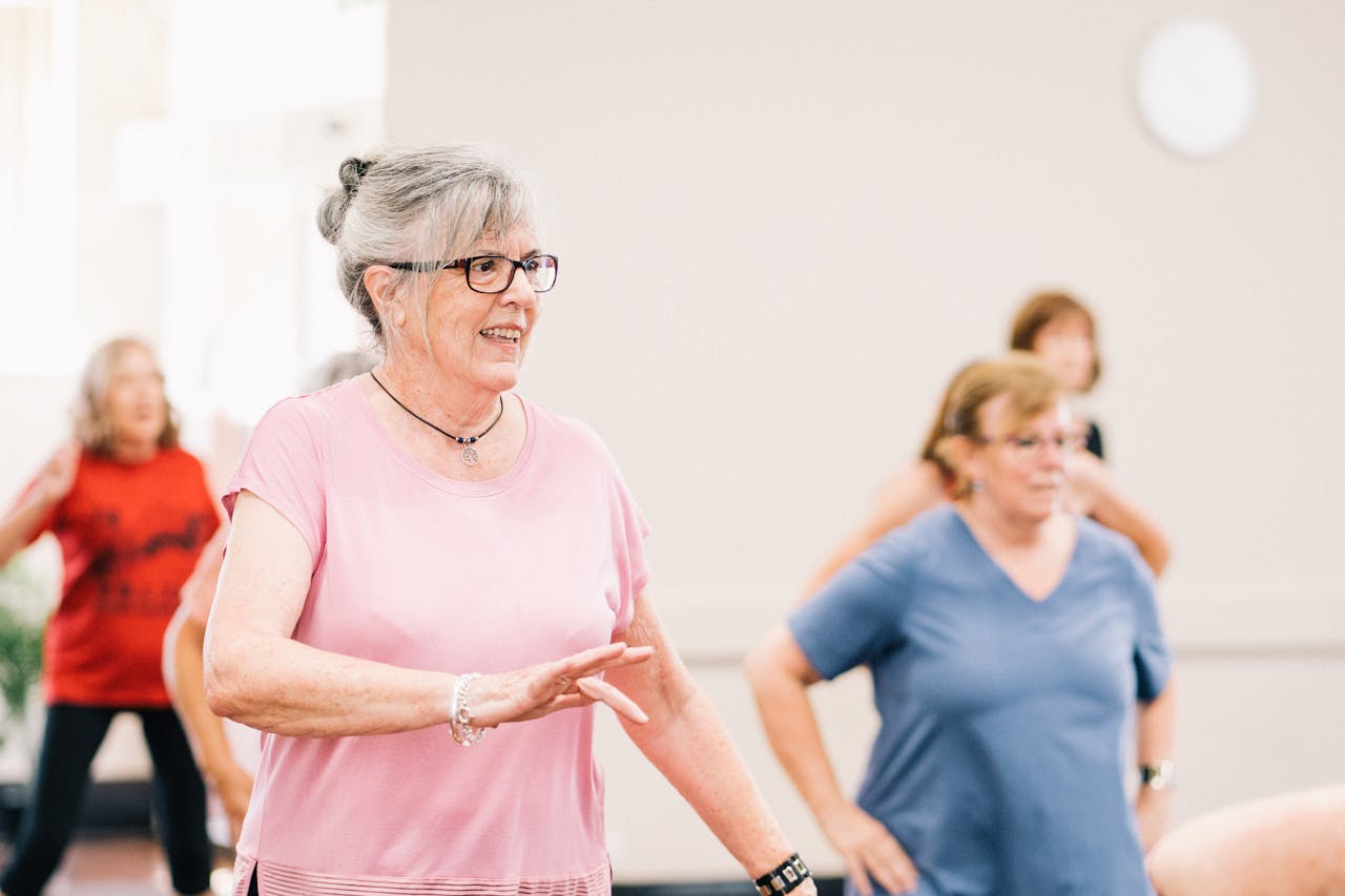 Group of women in an exercising class showcasing the social benefits of assisted living